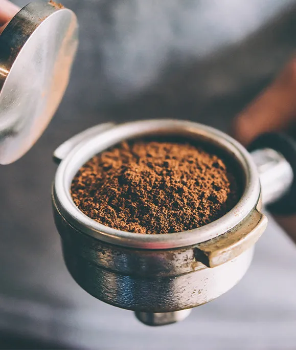 Freshly ground coffee in a portafilter